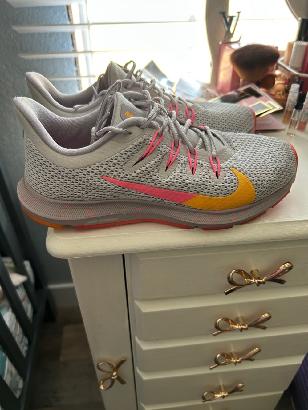 Nike Women's Light Gray Running Sneakers with Pink and Yellow Swoosh